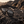 Load image into Gallery viewer, Lunettes de soleil Cassis posées sur une roche volcanique noire

