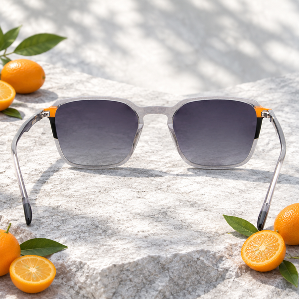 Lunettes de soleil Kumquat posées près de kumquats orange