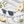 Load image into Gallery viewer, Lunettes de soleil Poire posées près d’une poire blanche
