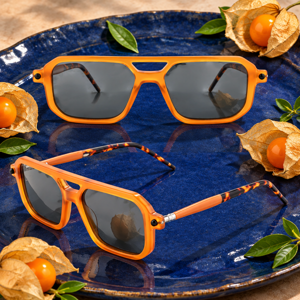 Lunettes Physalis orange posées près de fruits physalis